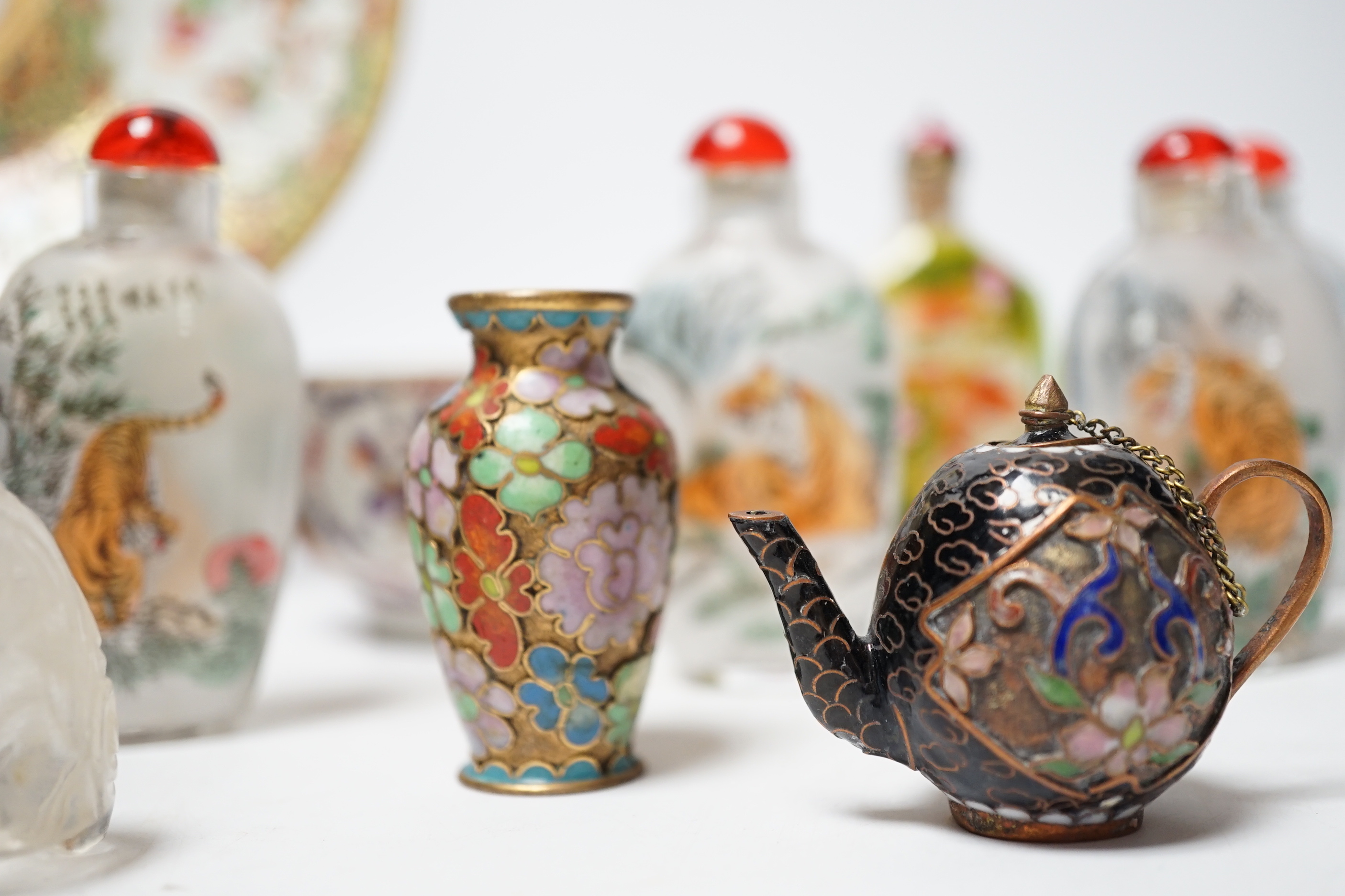 A collection of mixed Chinese scent bottles a famille rose plate and two tea bowls together with various Japanese items